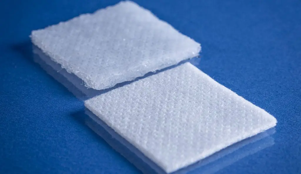 Type 9253 120gsm Superabsorbent Airlaid Fabric on a blue background