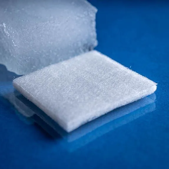 Type 2790 345gsm Superabsorbent Airlaid Fabric with a laminate nonwoven bottom layer shown on a blue background. Close up of dry fabric swatch