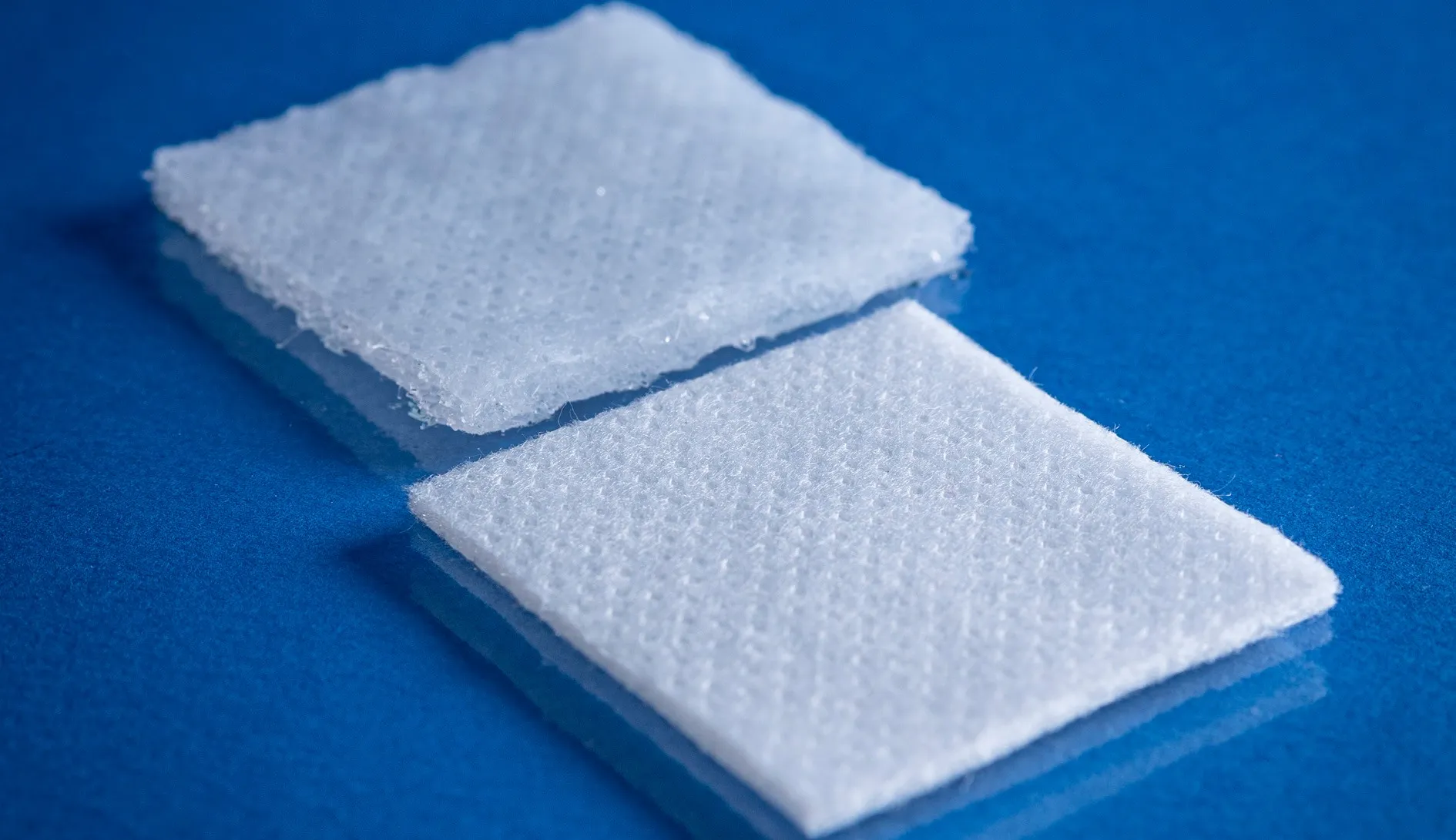 Type 9253 120gsm Superabsorbent Airlaid Fabric on a blue background